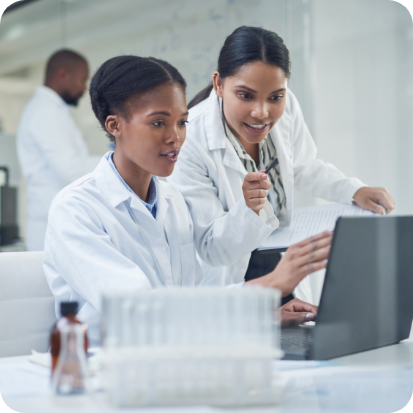 Two women using a laptop